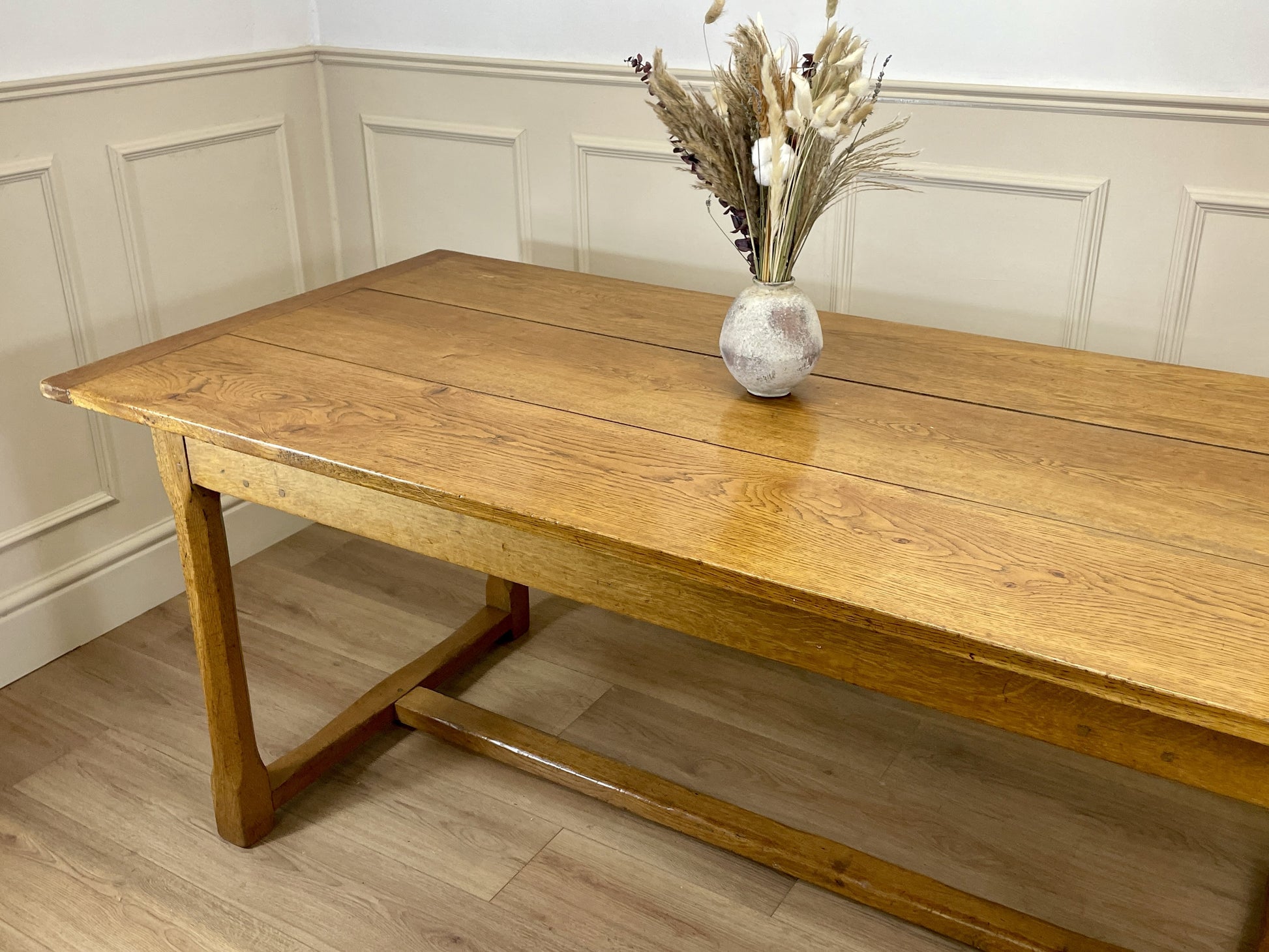 Light oak extendable dining table on square chamfered legs