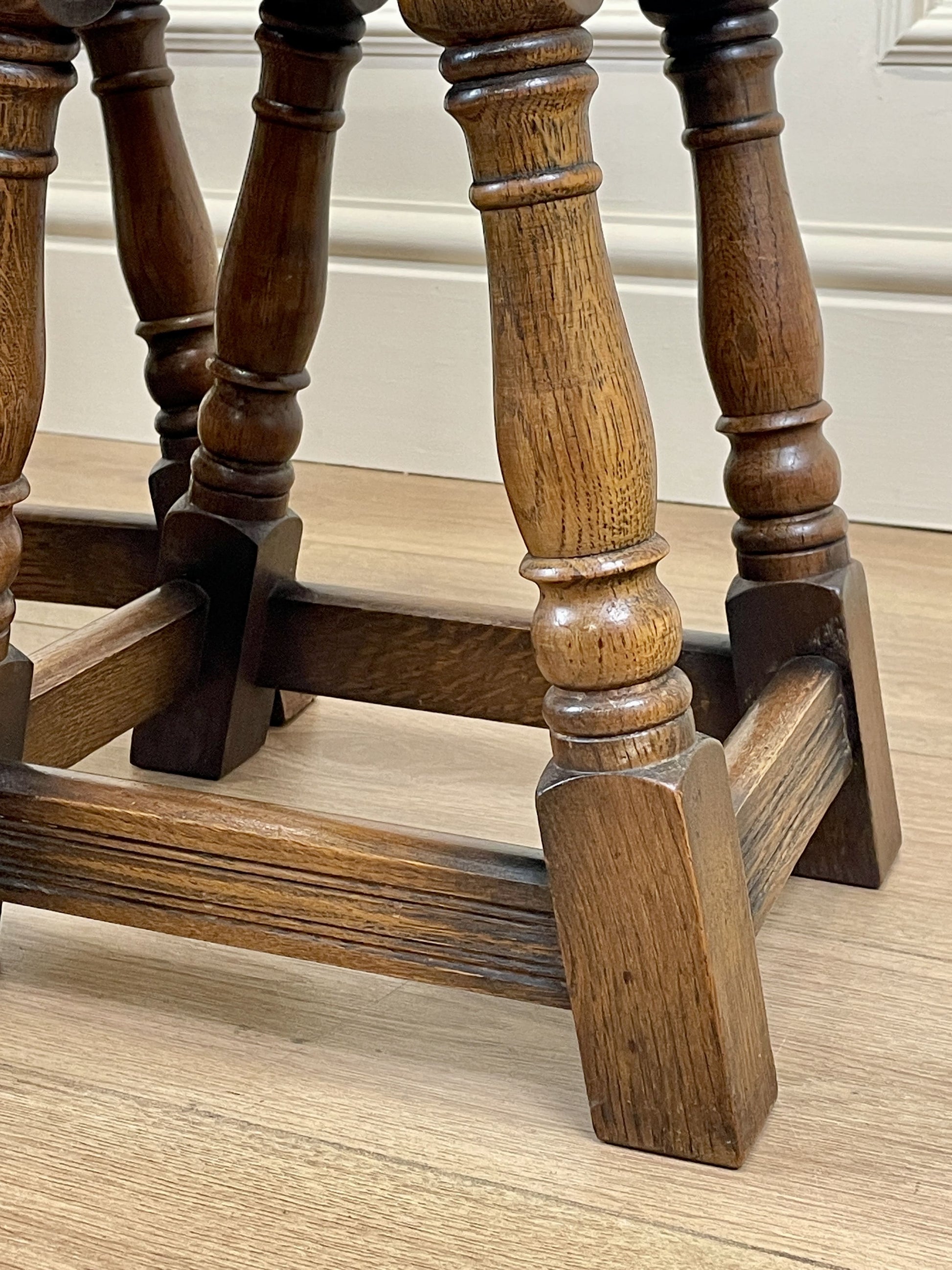 Vintage solid oak nest of 3 small tables with carved detail and splayed legs. Restored and ideal as practical antique side tables in any living room.